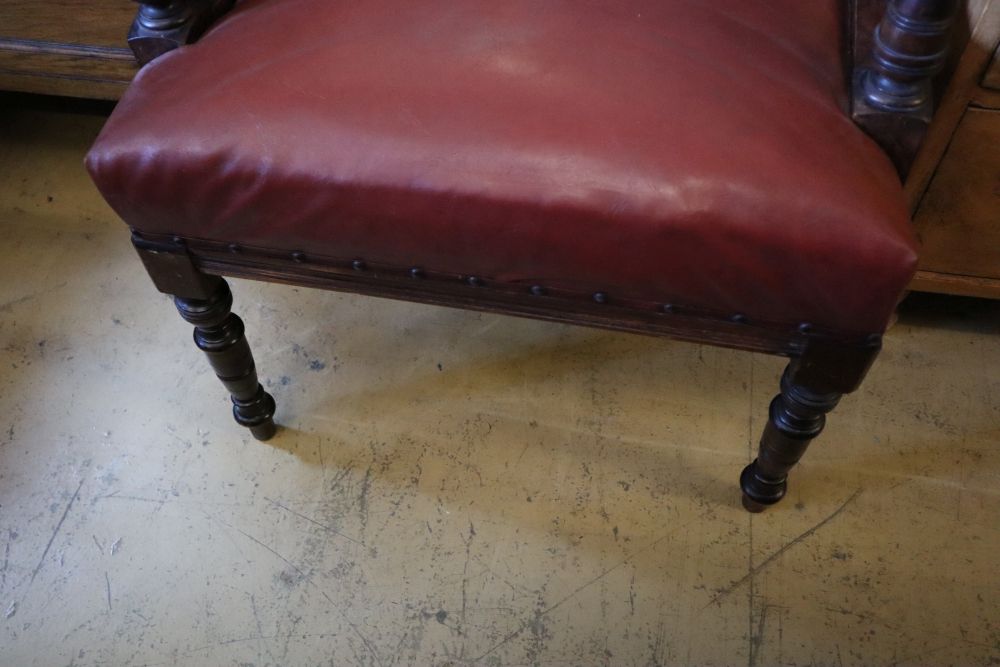 A Victorian mahogany tub frame library chair upholstered in buttoned upholstery, width 66cm